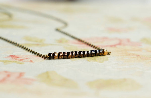 Sentimento - Gilded Black Beaded Bar Necklace