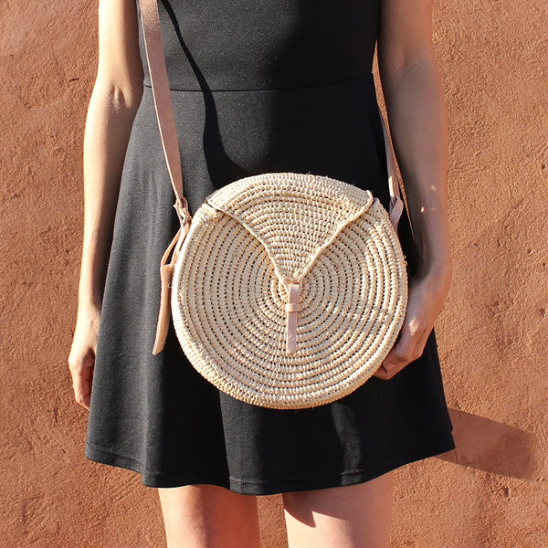 Small round natural straw bag